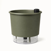 Vaso autoirrigável verde militar com reservatório transparente, vista frontal